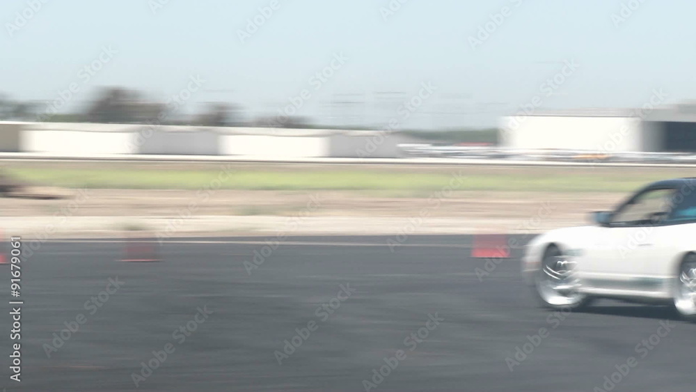 A driver does figure eights as it practices drifting at Camarillo Airport. A driver does figure eights as it practices drifting at Camarillo Airport.
