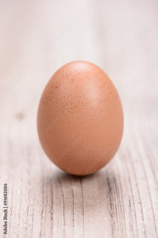Chicken egg on wood background Chicken egg on wood background