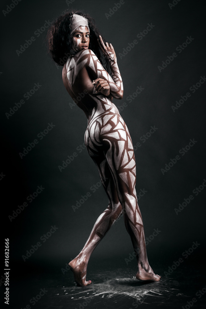 Fototapeta premium Gorgeous and sensual african model body covered with painted pol