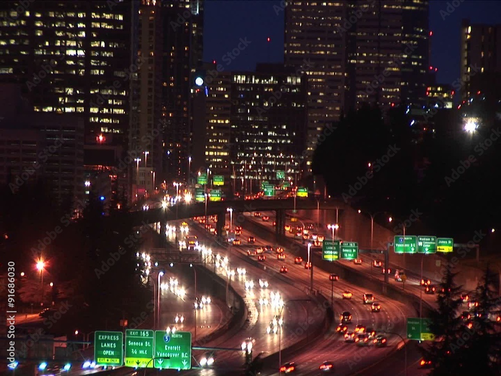 A hand-held camera zooms in and out, creating abstract, often explosive, images of Seattle at night. A hand-held camera zooms in and out, creating abstract, often explosive, images of Seattle at night.