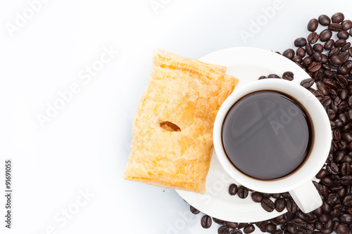 Cup of coffee with Pie on beans.