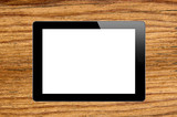 Black Touch Screen Tablet on wooden texture close-up