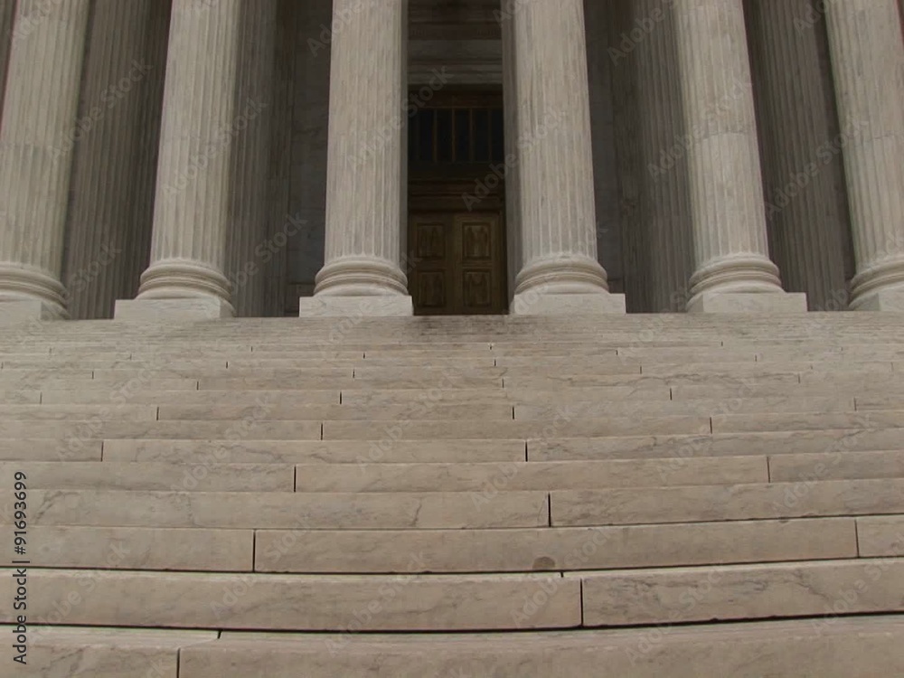 Stone steps lead to the columned entrance to the Supreme Court. Stone steps lead to the columned entrance to the Supreme Court.