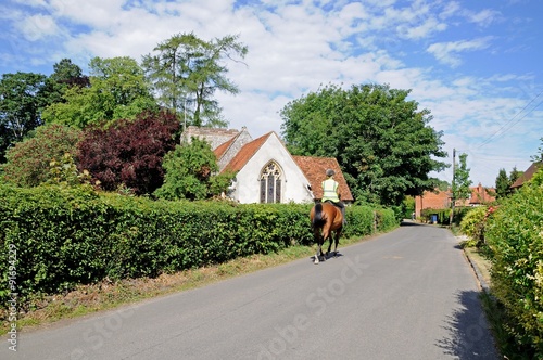 Horse riding through Turville Village. photo