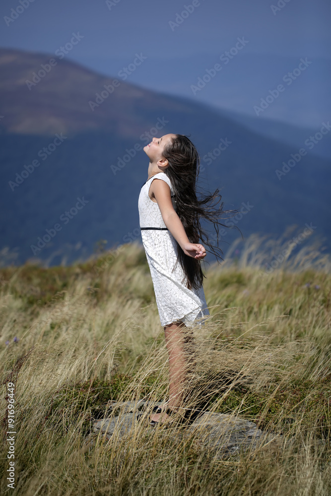 Cute girl in mountains