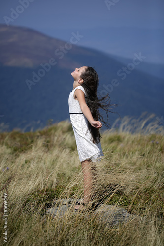 Cute girl in mountains