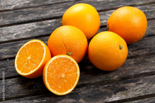 Beautiful Oranges on old wooden table. background, texture.