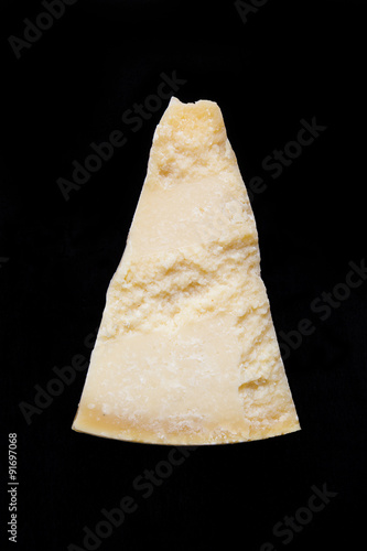 a piece of Parmesan cheese on dark