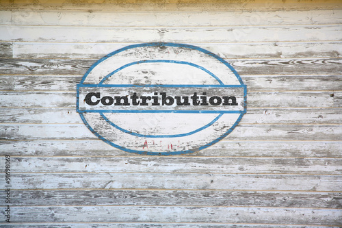 Contribution Concept - Contribution sign on shed side photo