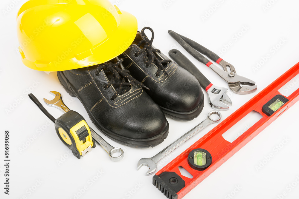 Yellow hard hat and tools Yellow hard hat and tools