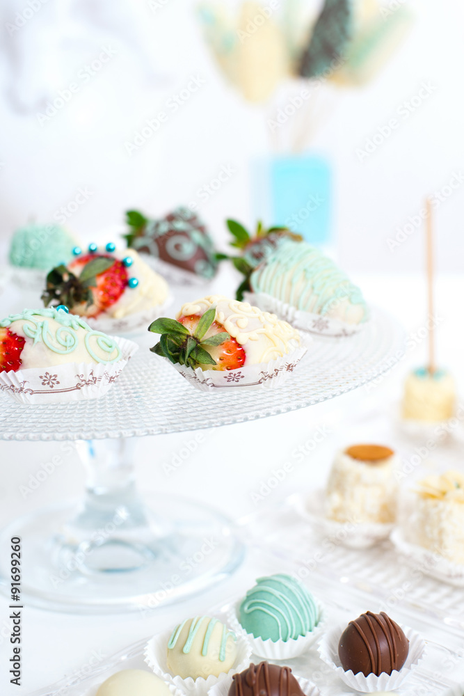 Variety of fruits covered with a color chocolate