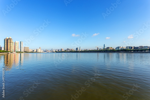 skyscrapers by the river bank