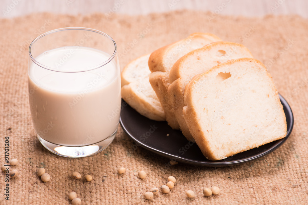 Soybeans and soy milk in a glass with fresh buns Soybeans and soy milk in a glass with fresh buns