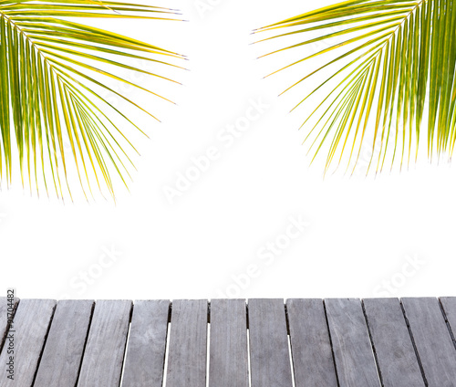 Fototapeta Naklejka Na Ścianę i Meble -  Wooden pier and palm tree leafs silhouette on white