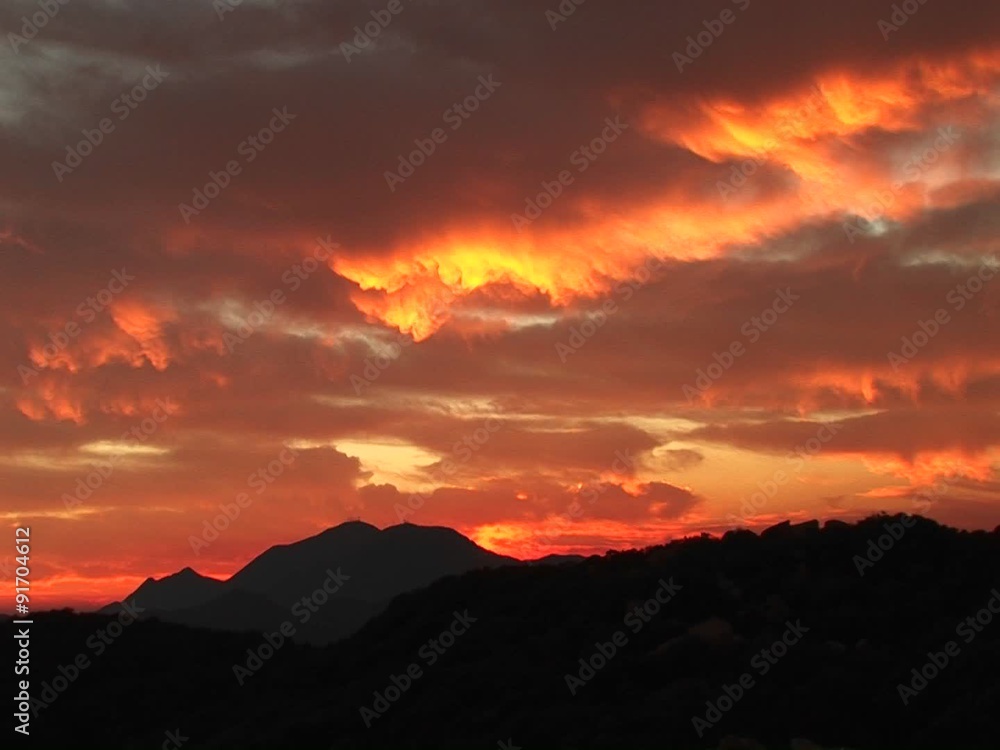 Medium-shot of a fiery sunset over the Santa Barbara Mountains, California. Medium-shot of a fiery sunset over the Santa Barbara Mountains, California.