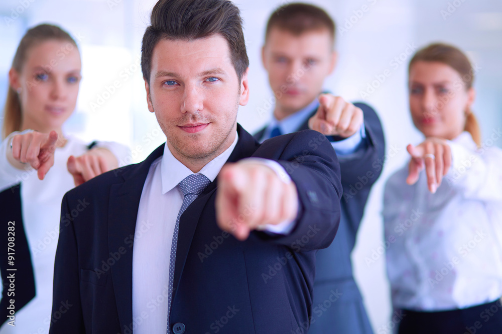 Group of business people pointing to you Group of business people pointing to you