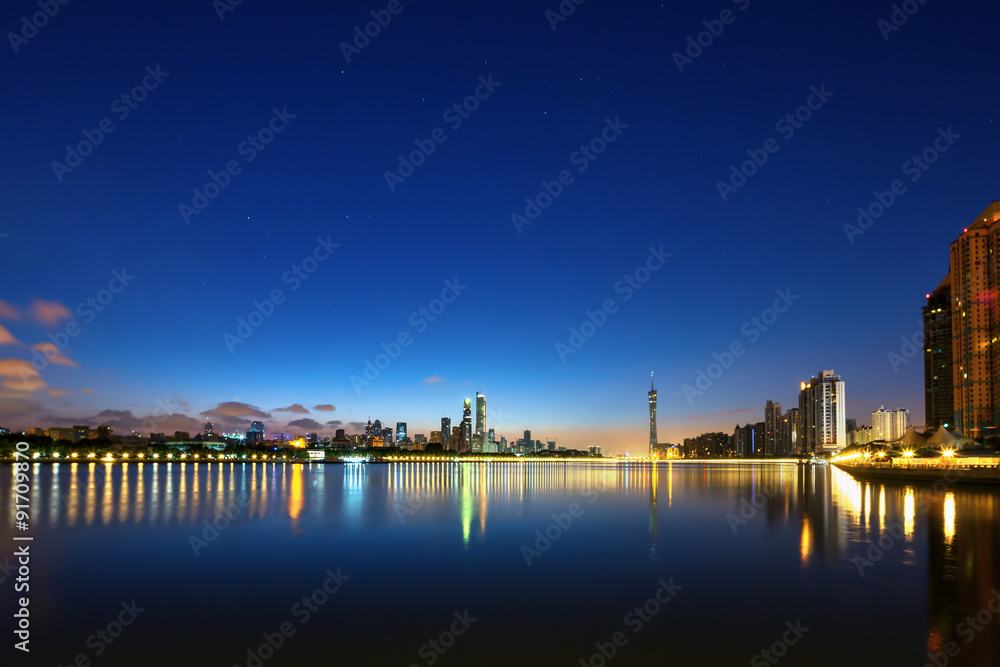 skyscrapers near the river at night