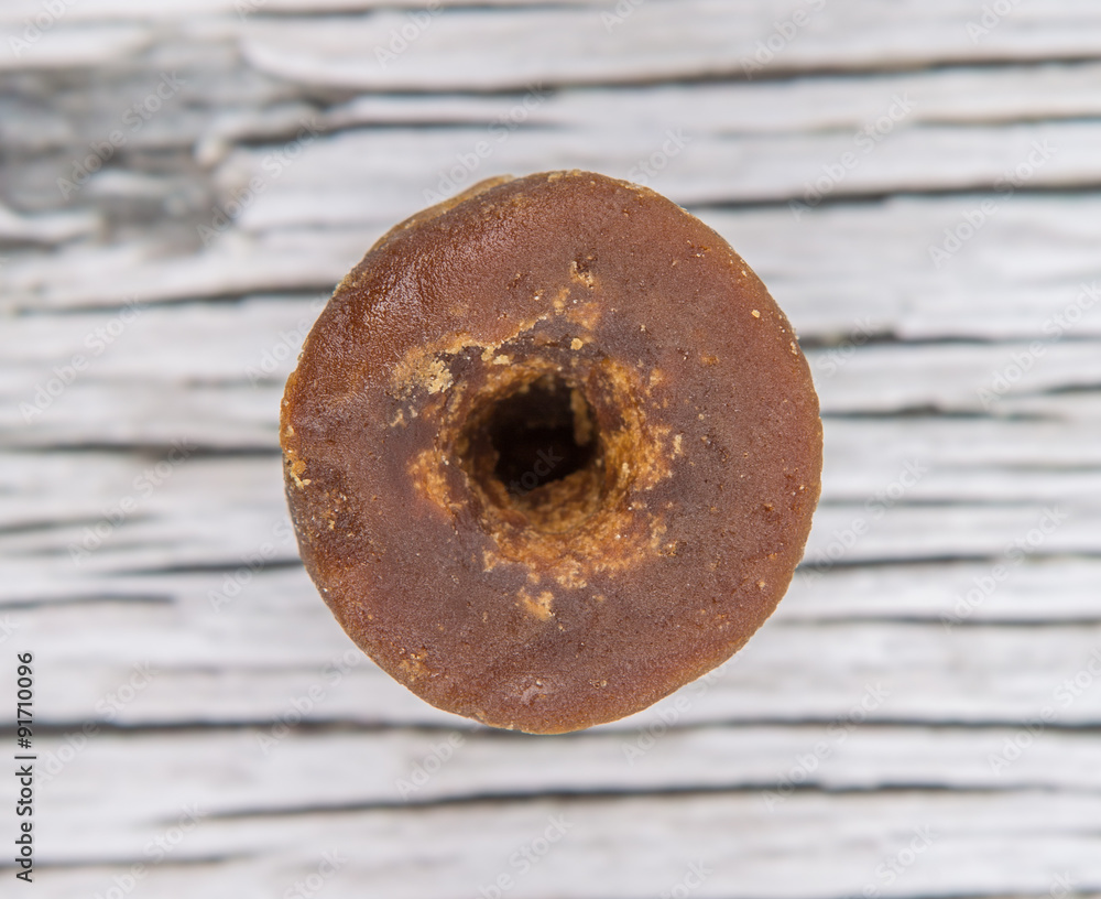 Brown coconut sugar over wooden background Brown coconut sugar over wooden background