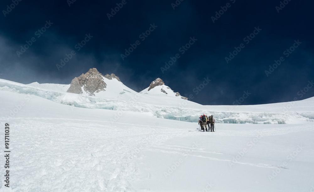 Group of alpinists on a glacier.