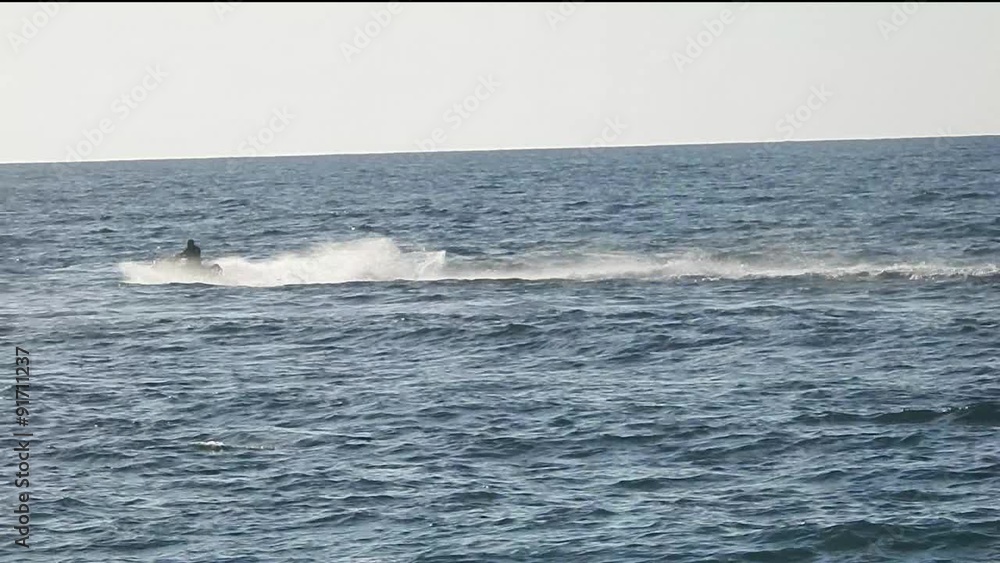 Marine motorcyclist rides the waves Marine motorcyclist rides the waves
