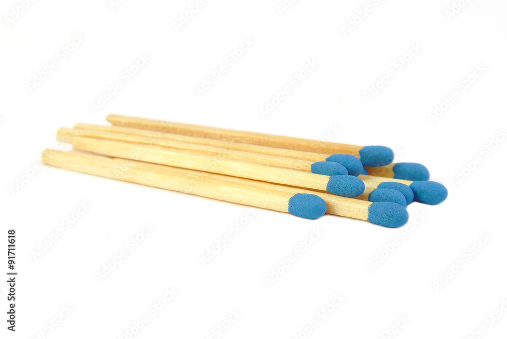 Some blue matches isolated on white background