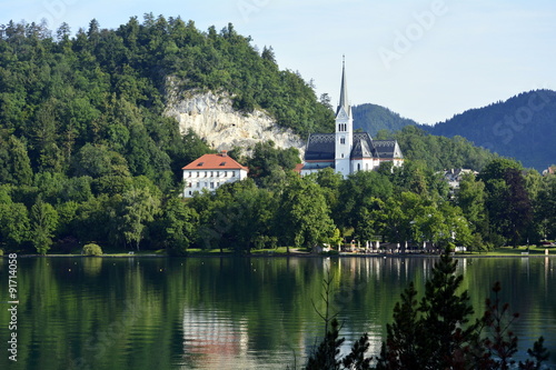 Iglesia en la orilla del lago Bled en los Alpes Julianos. Eslovenia  photo