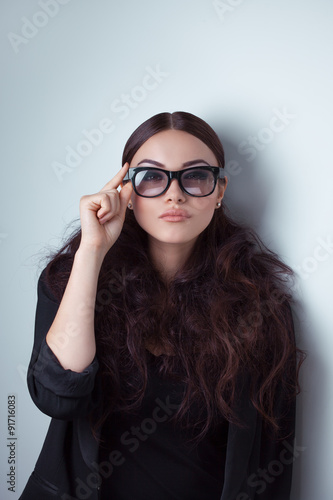 Beauty shot of a woman in stylish shades.