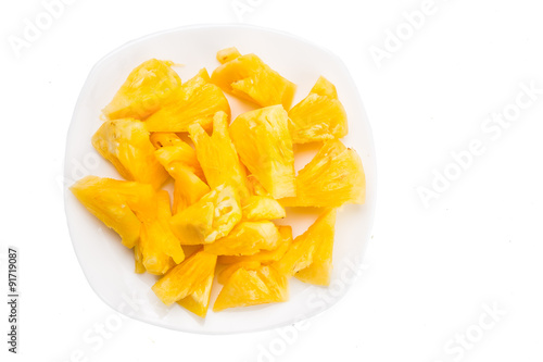 Freshly cut juicy, sweet nutritious pineapple fruit isolated in white