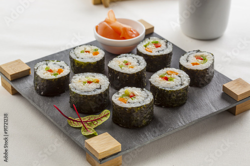 Futomaki, japanese food on a serving tablet