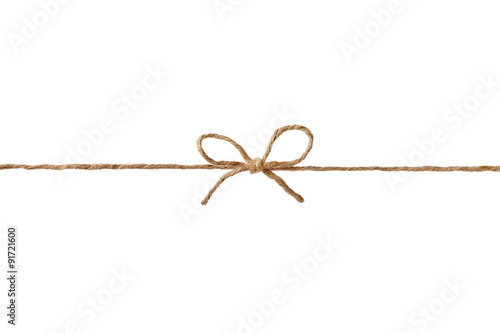 Closeup string or twine tied in a bow isolated on white background photo