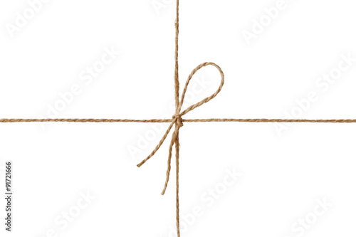 Closeup string or twine tied in a bow isolated on white background
