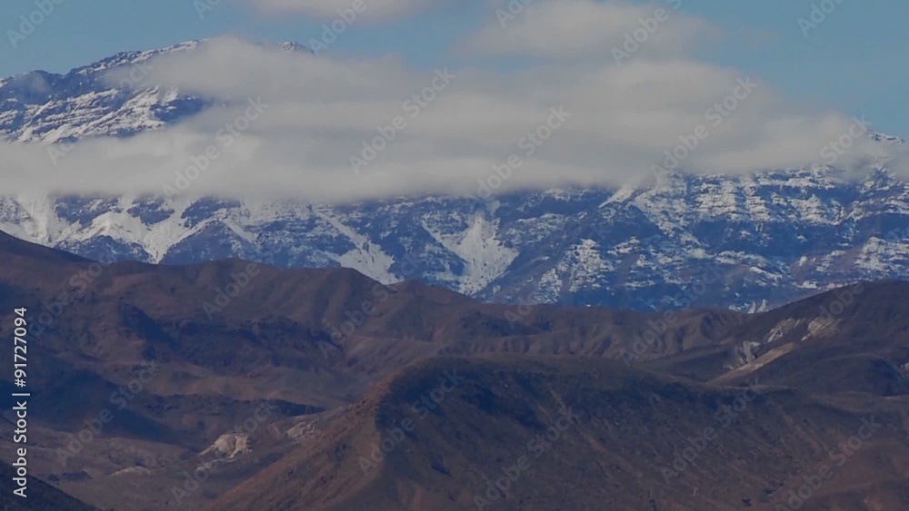 A slow move back on a time lapse of a beautiful mountain range in winter in Death Valley. A slow move back on a time lapse of a beautiful mountain range in winter in Death Valley.