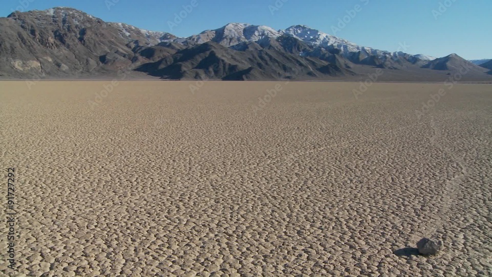 The mysterious rocks which race across the dry lakebed known as the Racetrack in Death Valley. The mysterious rocks which race across the dry lakebed known as the Racetrack in Death Valley.