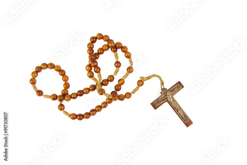 Fotografiet Wooden rosary with cross isolasted on a white background
