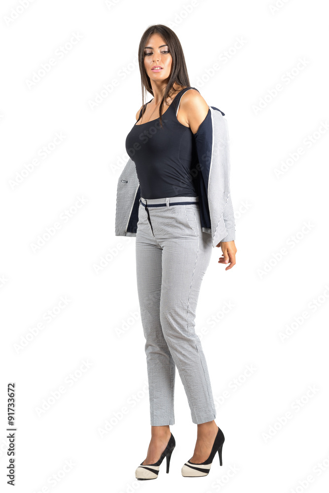Sexy young business woman in formal wear taking off jacket. Sexy young business woman in formal wear taking off jacket.