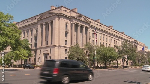 The National Archives building in Washington DC with traffic passing. photo