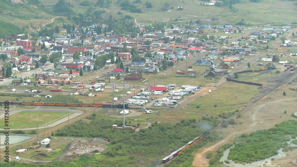 A very distant shot of a steam train arriving in Silverton, Colorado. A very distant shot of a steam train arriving in Silverton, Colorado.