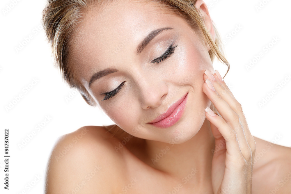 Studio shot of a beautiful young woman with perfect skin against Studio shot of a beautiful young woman with perfect skin against
