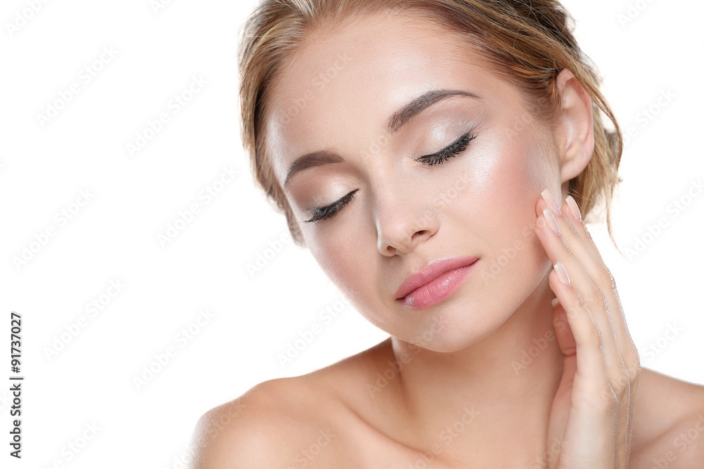 Studio shot of a beautiful young woman with perfect skin against