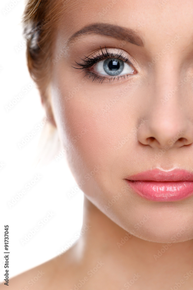 Studio shot of a beautiful young woman with perfect skin against Studio shot of a beautiful young woman with perfect skin against