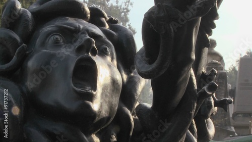 A statue of Medusa seems to be crying out in horror. photo