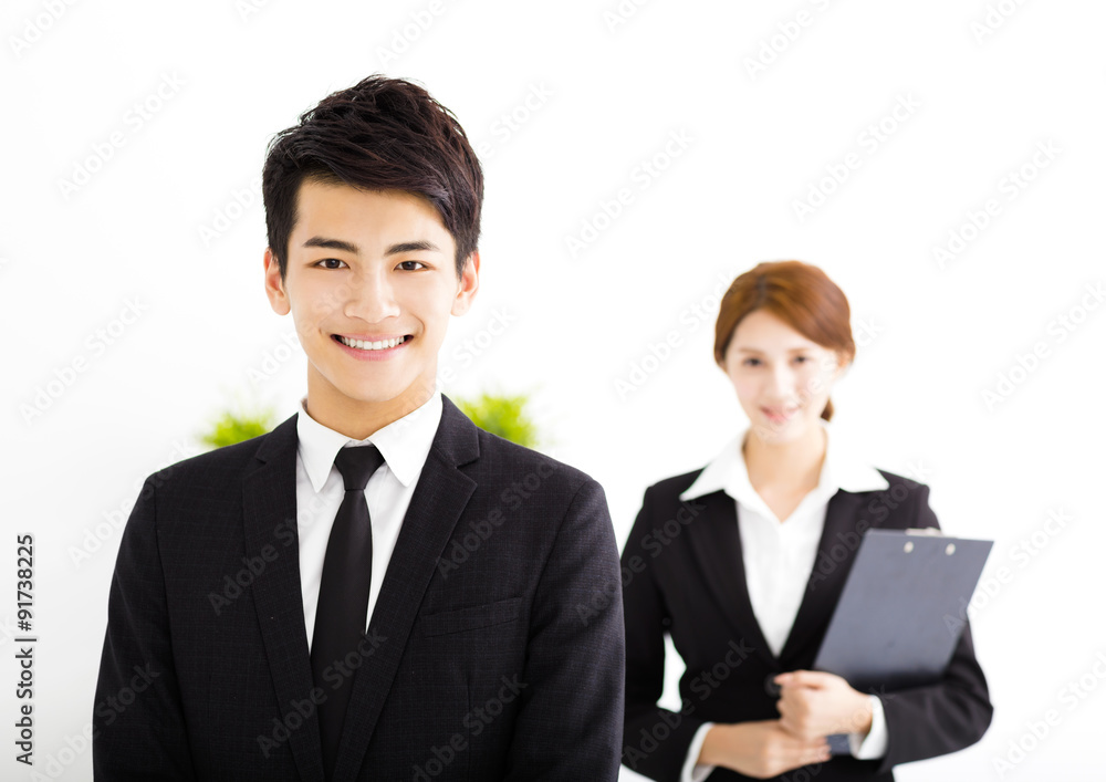 happy business man and woman standing in office happy business man and woman standing in office