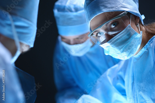 Shot of surgeons working on a patient in an operating room.