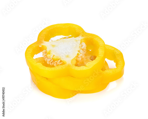 yellow pepper slices on white background