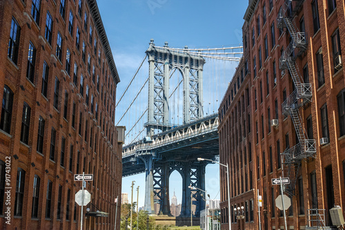 New York City Manhattan Bridge and brick wall buildings