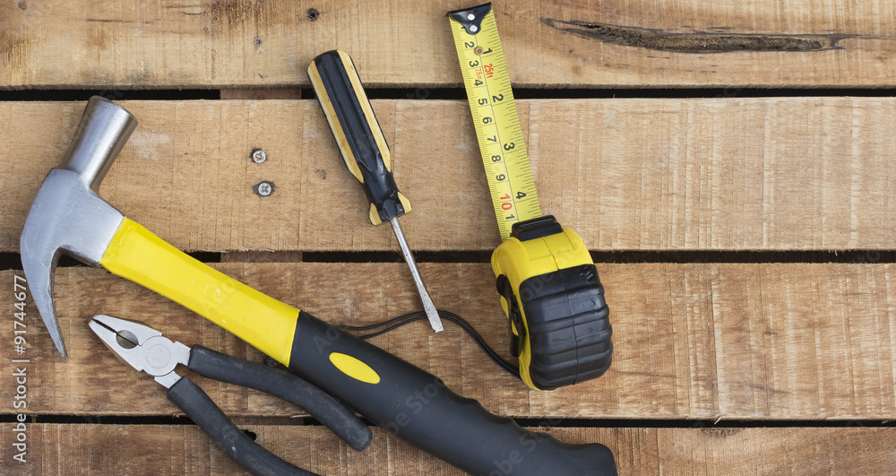 Assorted work tools on wooden table