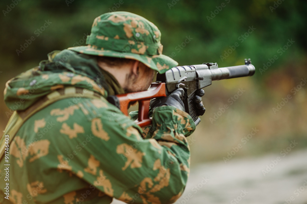 Fototapeta premium russian soldier in the battlefield with a rifle