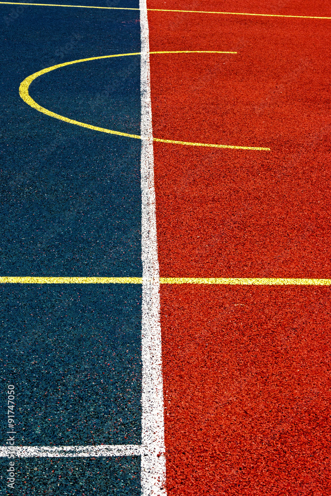 Sports field with synthetic turf and different markings, used in sports.