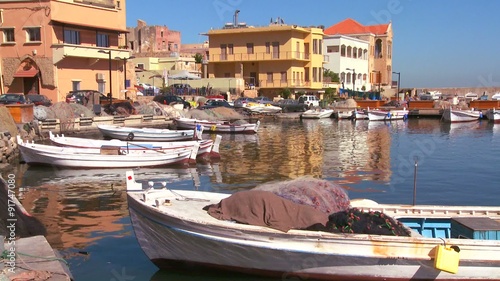 The fishing village of Tyre, Lebanon with boats in foreground. photo