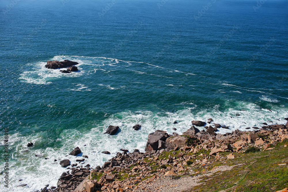 view from the cliff to the stones and ocean view from the cliff to the stones and ocean